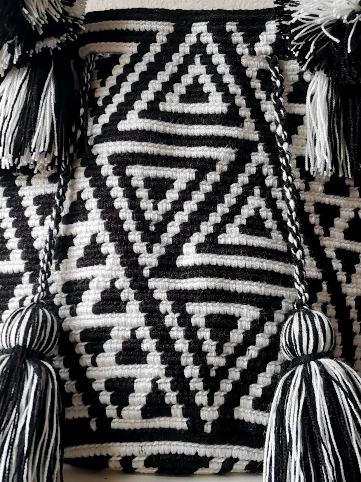 Black and white M mochila handbag