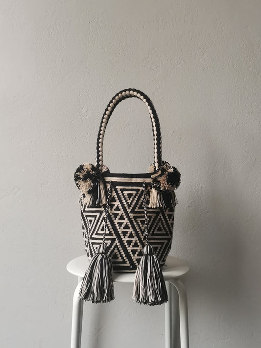 Black and white M mochila handbag