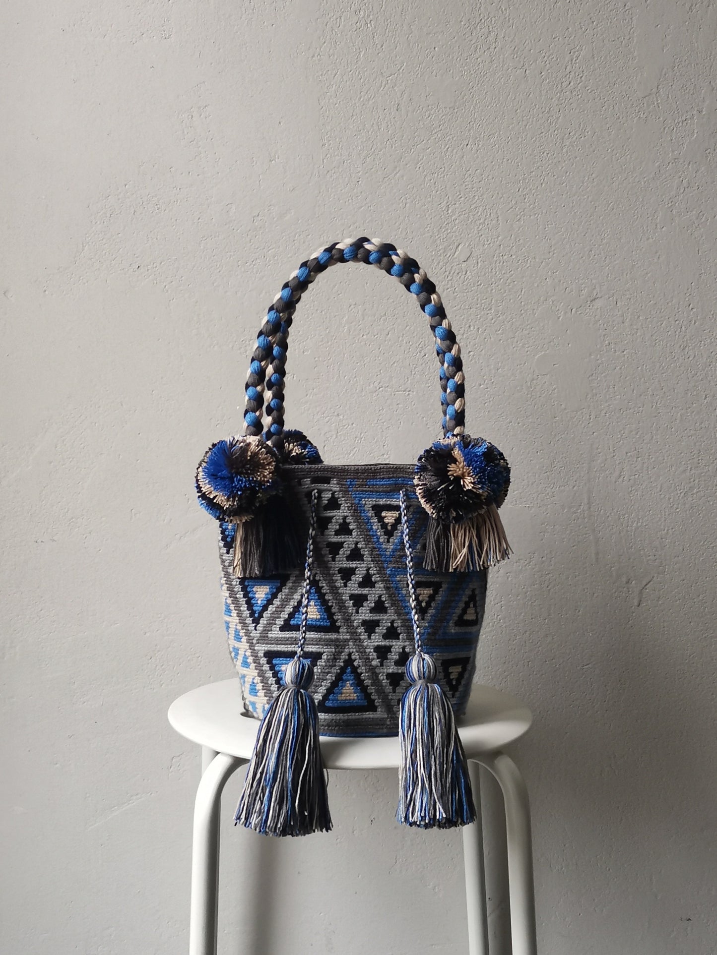 Gray and blue M mochila handbag