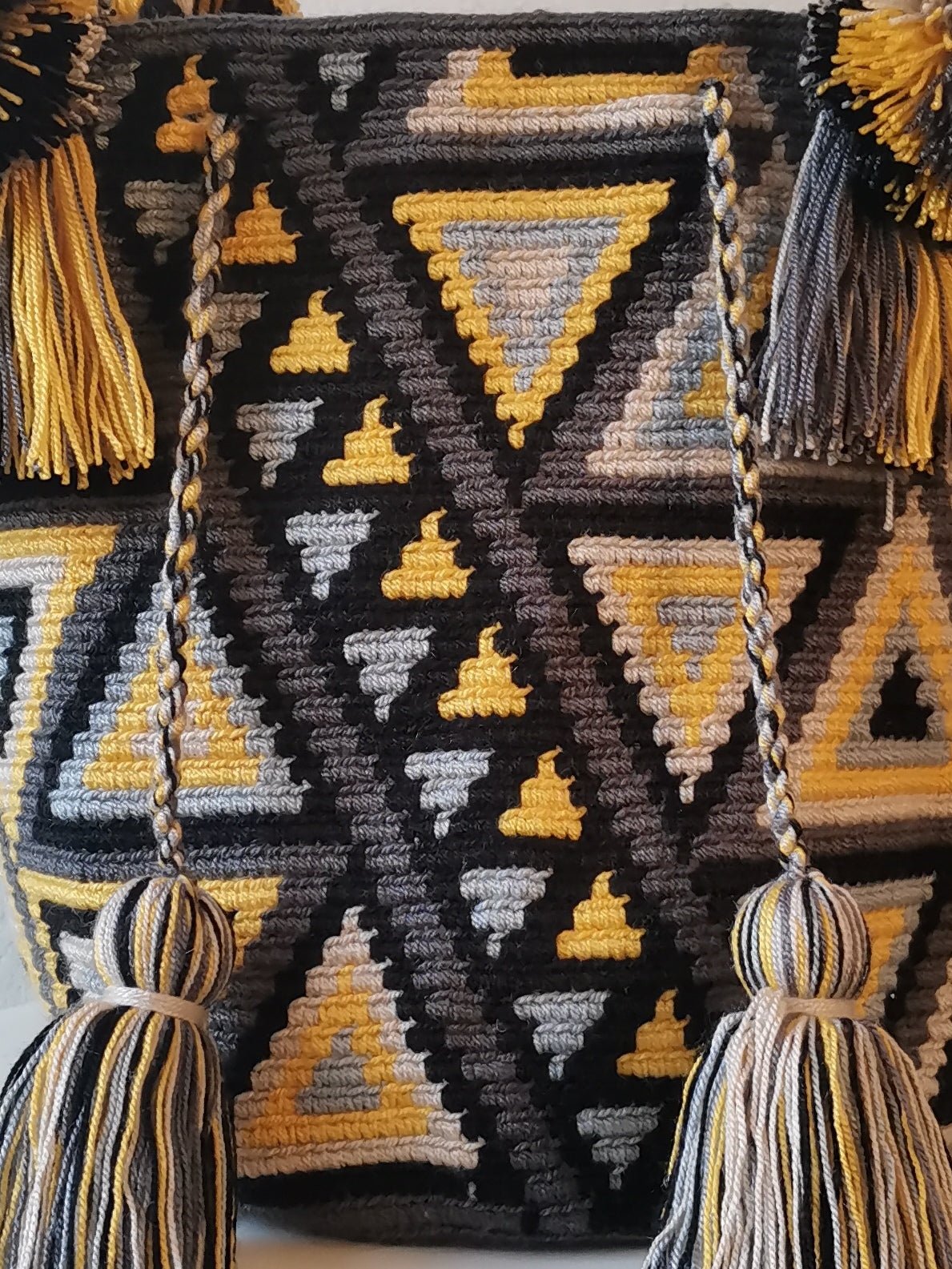 Dark gray and yellow M mochila handbag