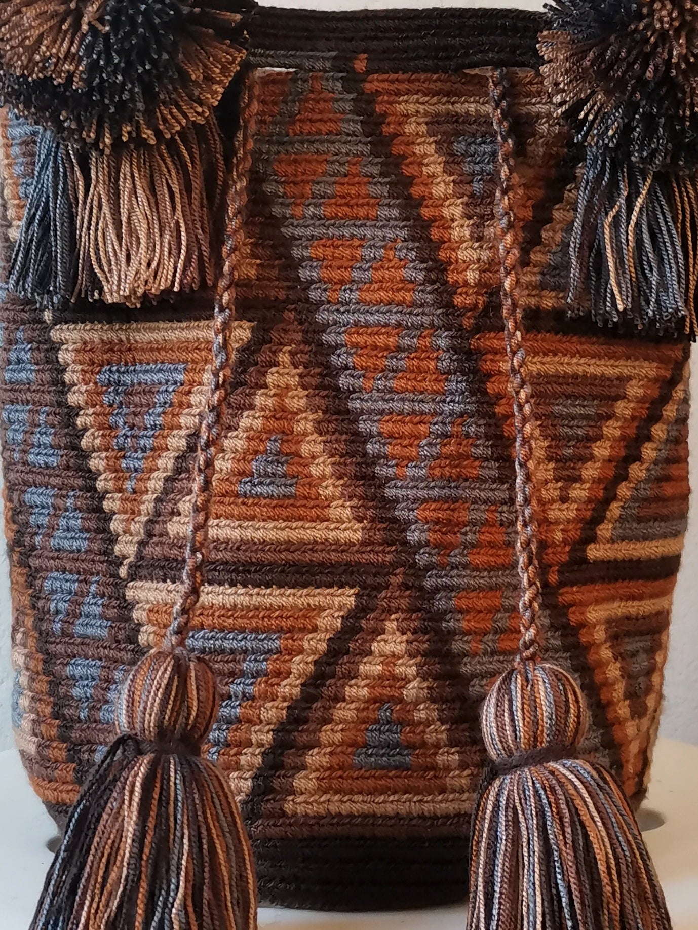Brown and gray M mochila handbag