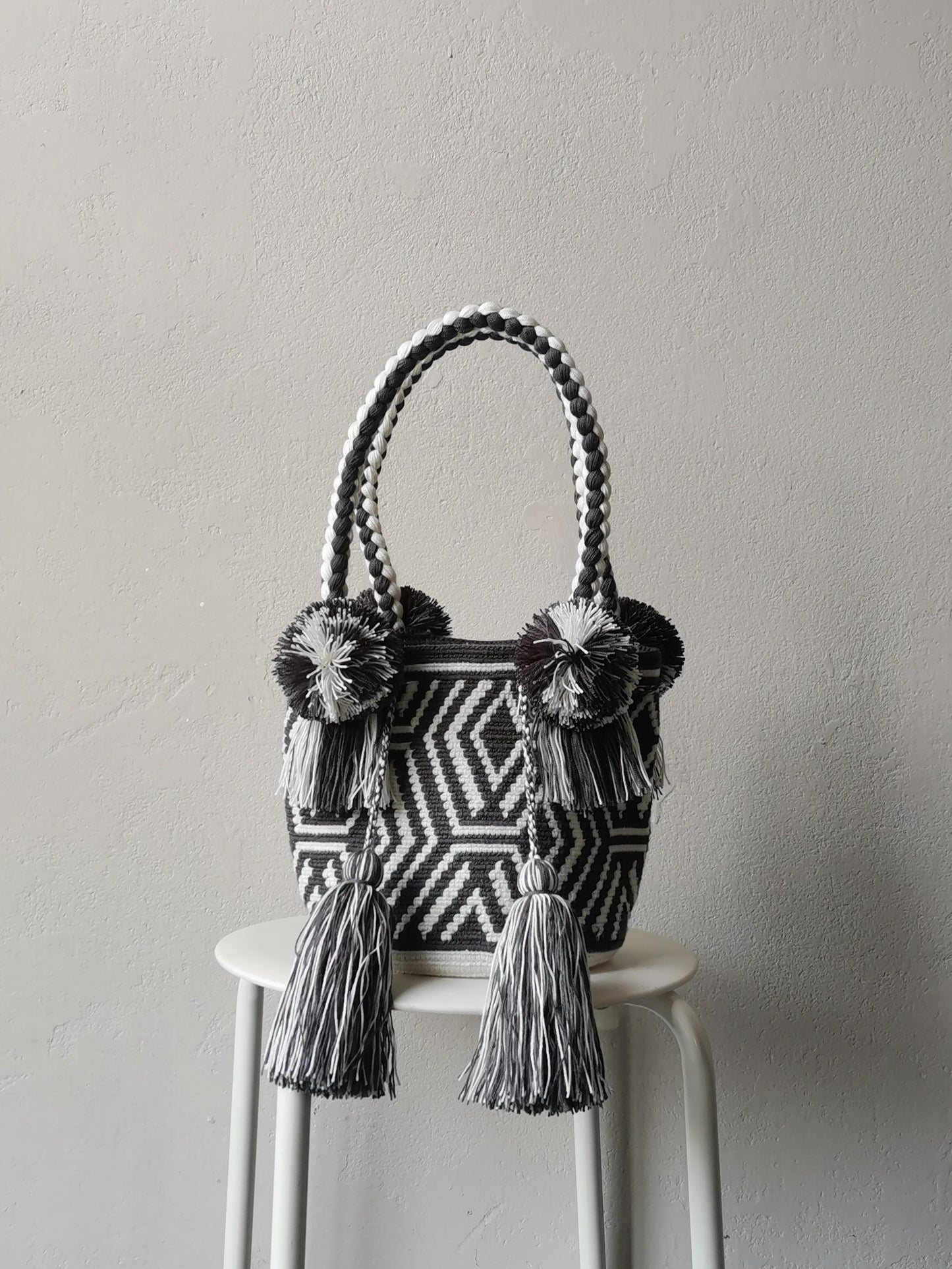White and dark gray M mochila handbag